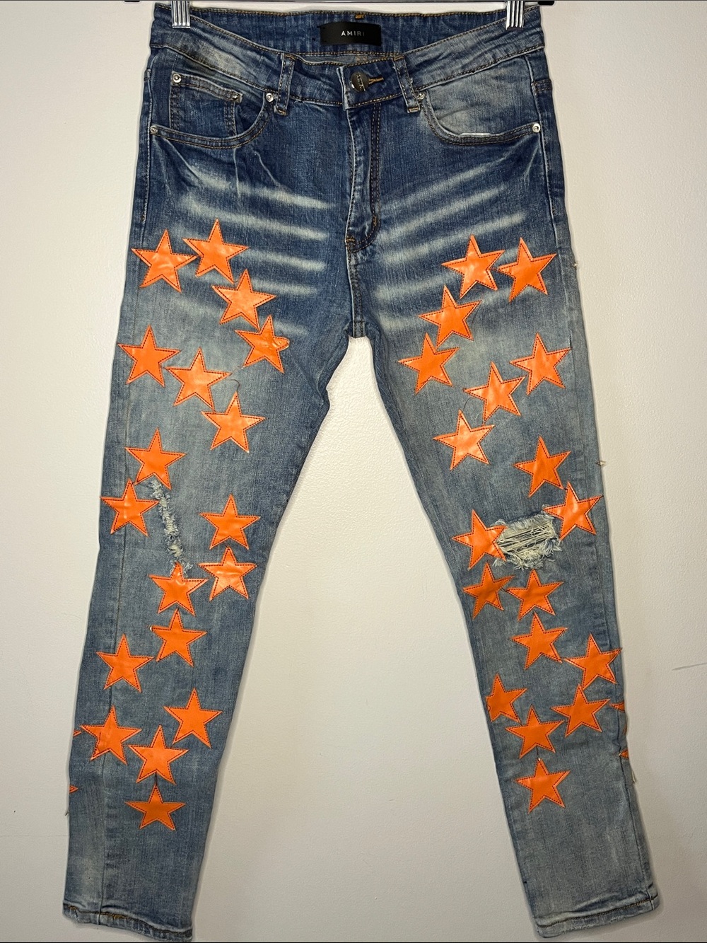“Amiri” Denim orange star embellished Skinny Jeans